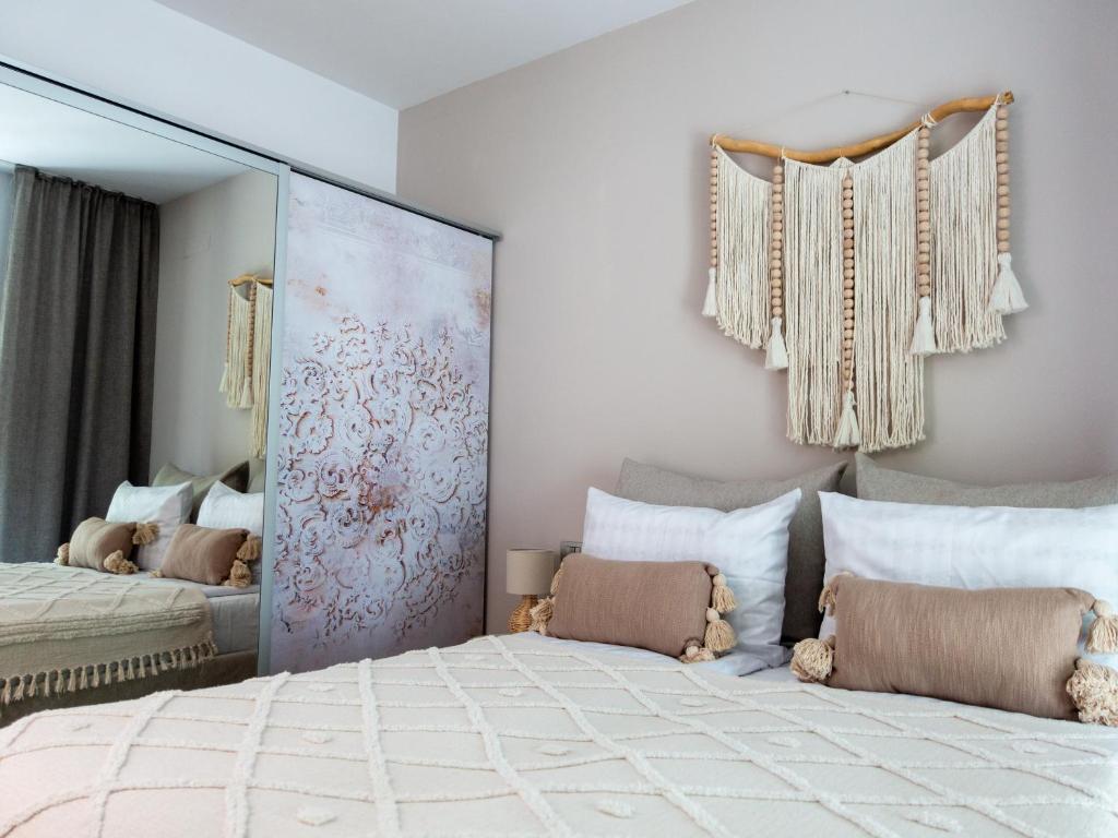 a bedroom with a large mirror and a bed at La Bella Riva in Sarnico