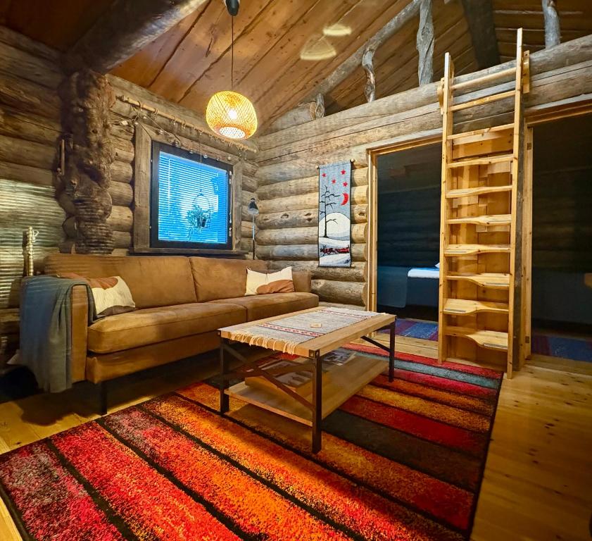 a living room with a couch and a bunk bed at Holiday Hopukka in Luosto