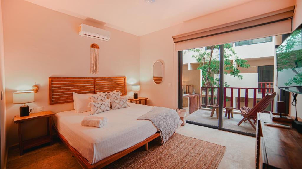 Giường trong phòng chung tại SmartDepas Tulum