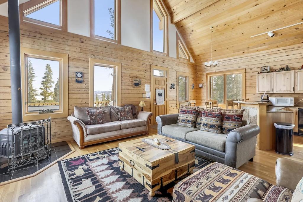 a living room with two couches and a table at Beautiful Peak 7 Private Home in Breckenridge