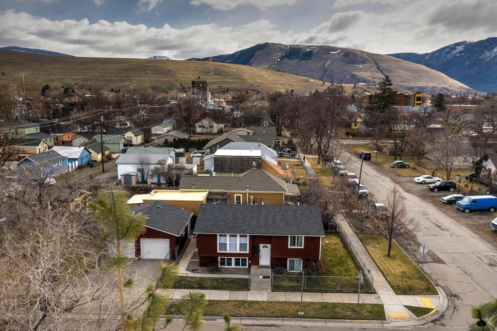 an aerial view of a town with houses and a mountain at Northside Abode Close to Downtown in Missoula