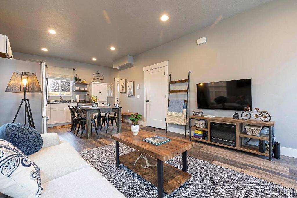 a living room with a couch and a table at Modern abode in Central Missoula! in Missoula