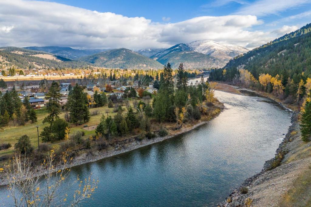 an aerial view of a river in the mountains at Close to downtown on Riverfront Park in Missoula
