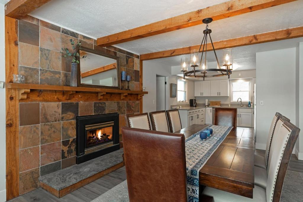 a dining room and kitchen with a fireplace at Salish Court in Missoula