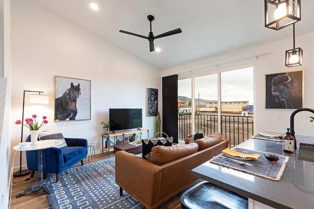 a living room with a couch and a table at The Railway Lofts 202 in Missoula