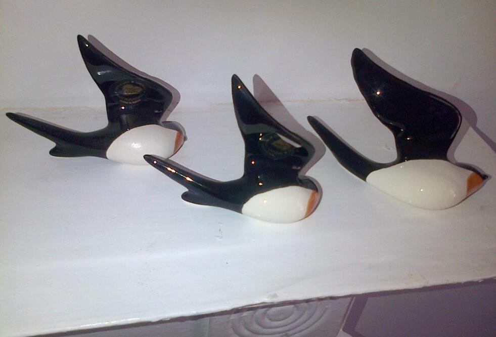 three black and white vases sitting on a shelf at Andorinho Sea View Apartment in Margate