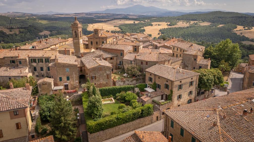 an aerial view of a village with a church at Casa Nobile - Luxury Villa in Val D'Orcia - Authentic Tuscany Living in Castelmuzio