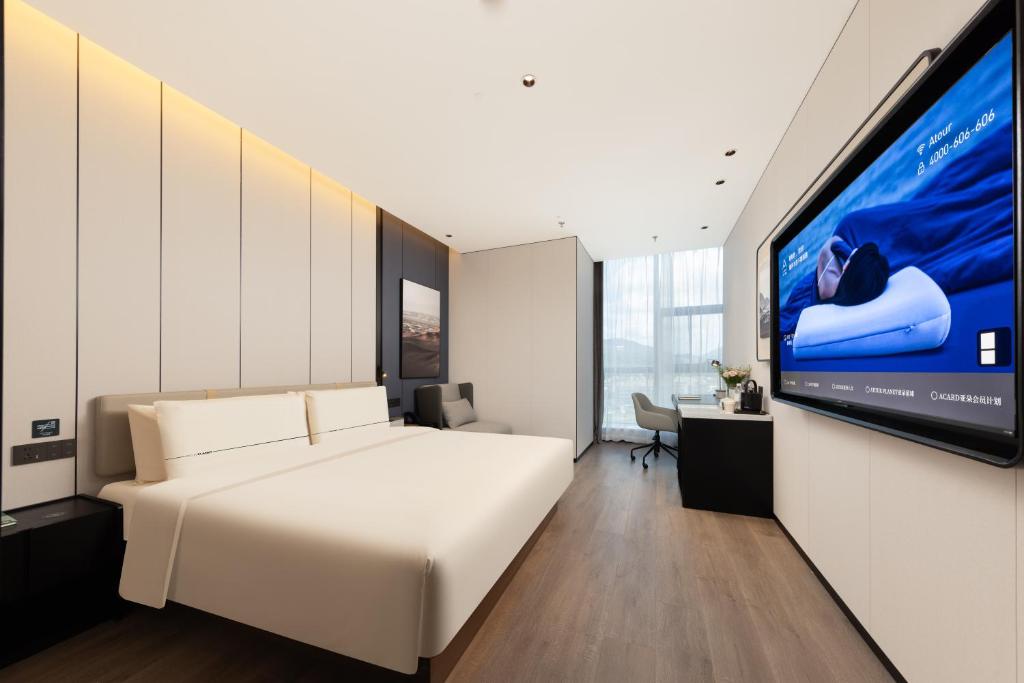 Ένα ή περισσότερα κρεβάτια σε δωμάτιο στο Atour Hotel Dinghai Ancient City Zhoushan