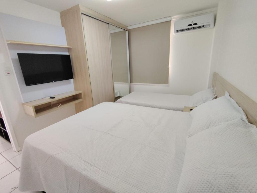 En eller flere senge i et værelse på Resort Grand solare residence