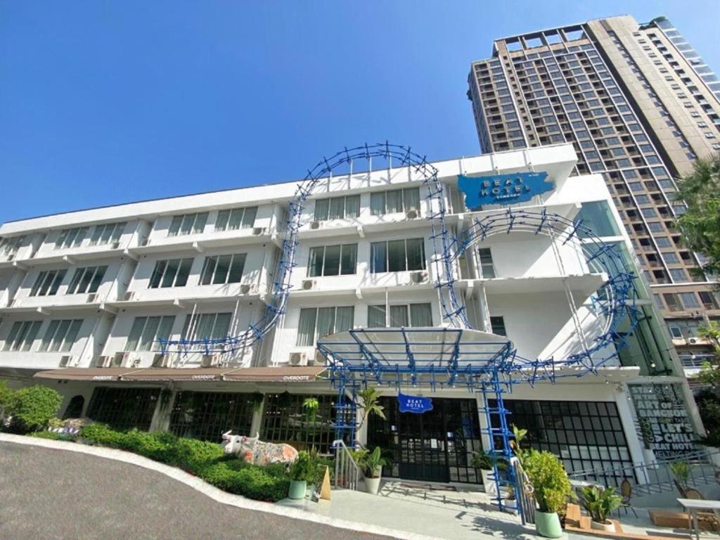 a building with blue scaffolding on the side of it at Beat Hotel Bangkok in Bangkok