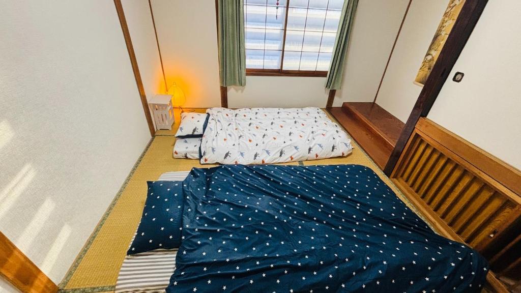 Ένα ή περισσότερα κρεβάτια σε δωμάτιο στο secondhouse - Vacation STAY 80486v