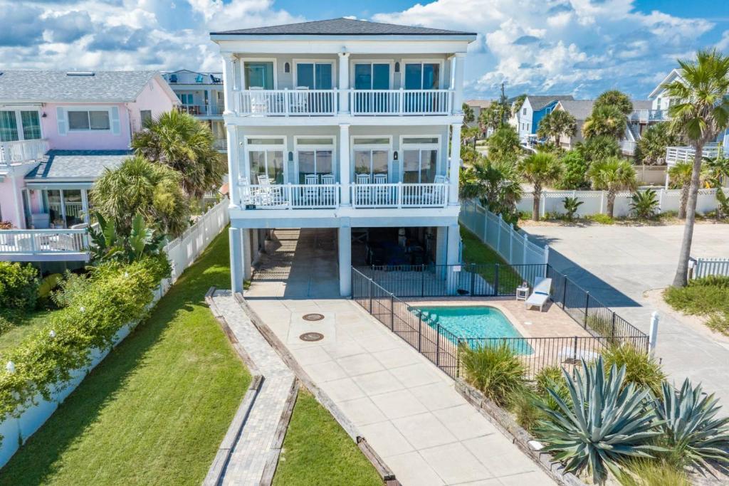 an aerial view of a house with a swimming pool at A Pirate's Paradise in St. Augustine