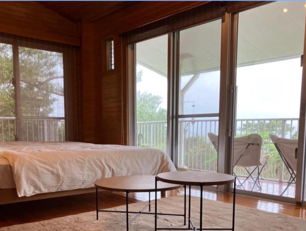 a bedroom with a bed and two tables at Inn Suenaga - Vacation STAY 25965v in Hiji