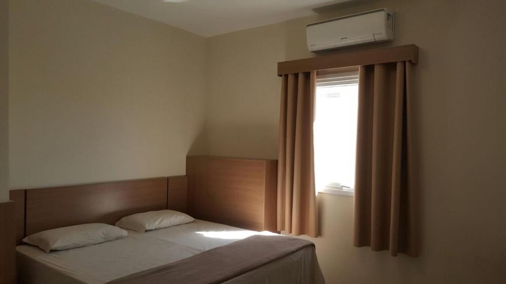 Tempat tidur dalam kamar di Hotel Real