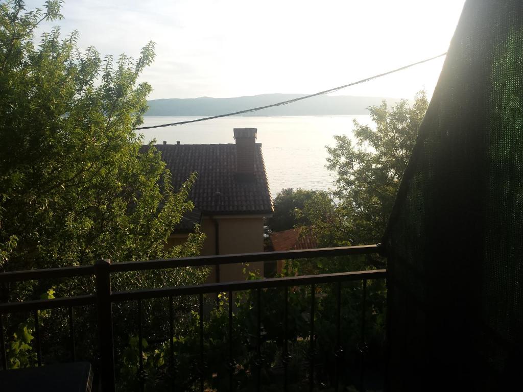 a view from the balcony of a house with a fence at Guest House Sombrero in Senj