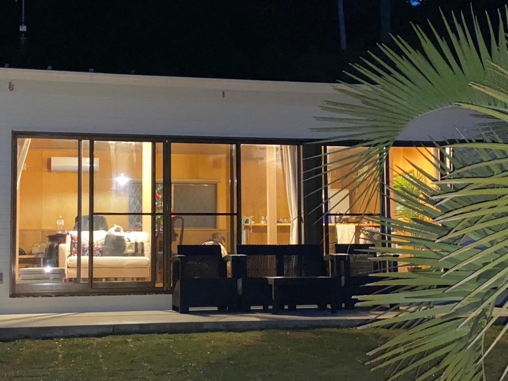 a building with glass windows and a living room at Shell Beach Hamanako - Vacation STAY 14730 in Hamamatsu