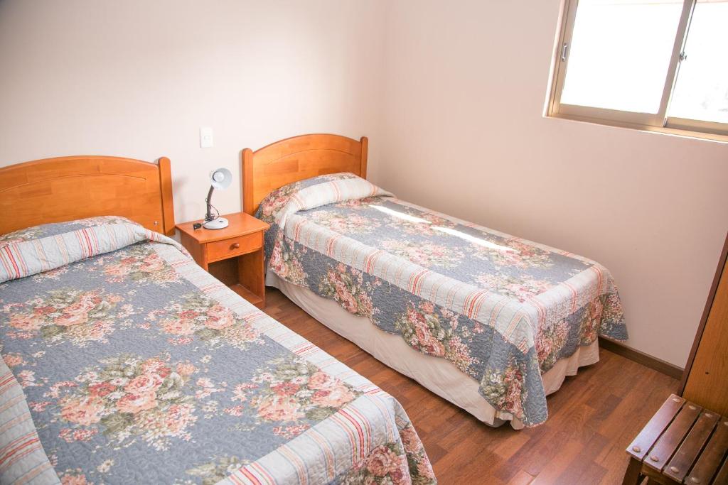 Postel nebo postele na pokoji v ubytování Cabañas Las Añañucas V