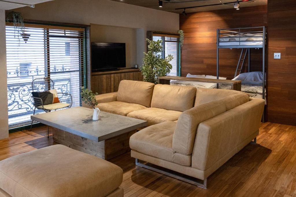 a living room with a couch and a table at Sun Mall 3rd Mansion 602 - Vacation STAY 14779 in Tokyo