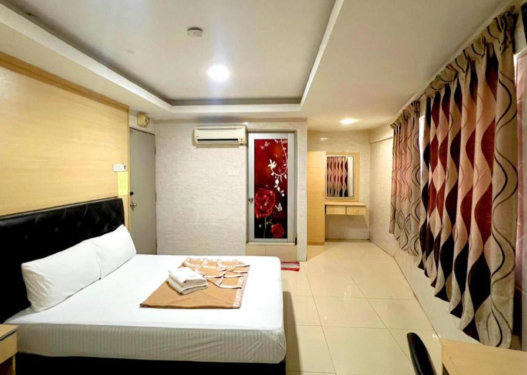 Postel nebo postele na pokoji v ubytování New Wave Sri Hartamas