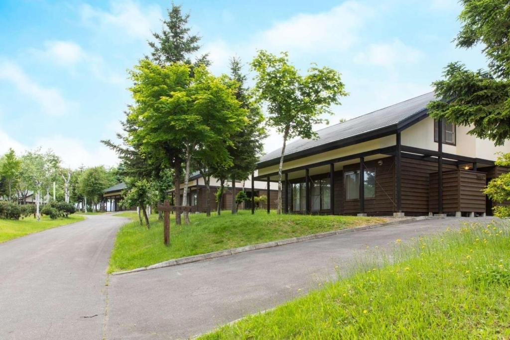 a building with a road in front of it at Kabato County - Camp - Vacation STAY 42252v in Shintotsukawa