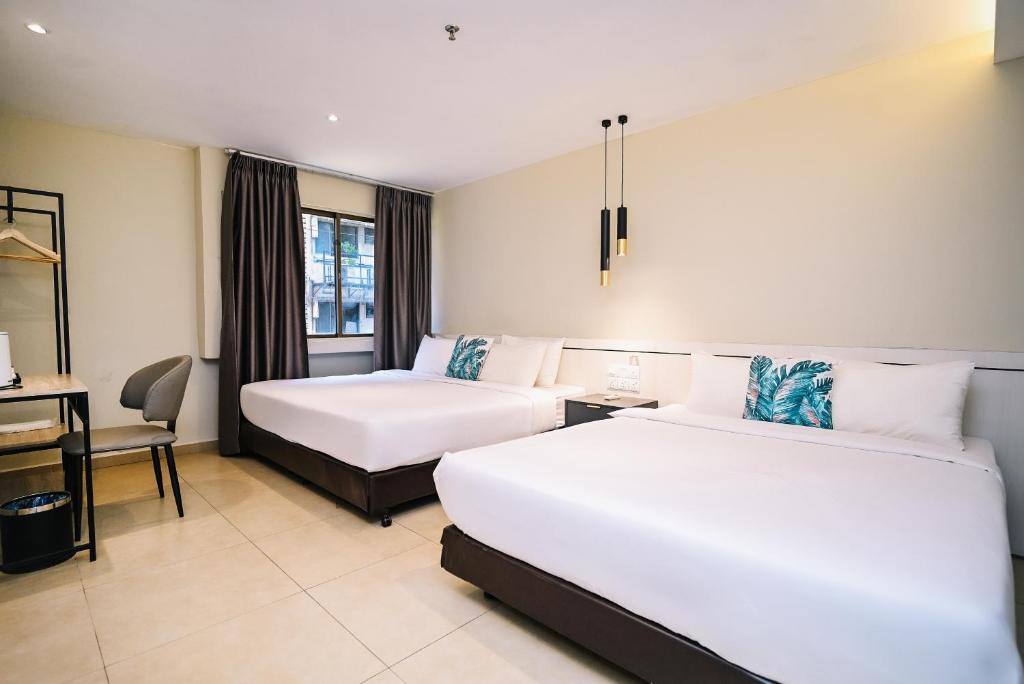 Giường trong phòng chung tại Kingston Hotel 1 - Bukit Bintang