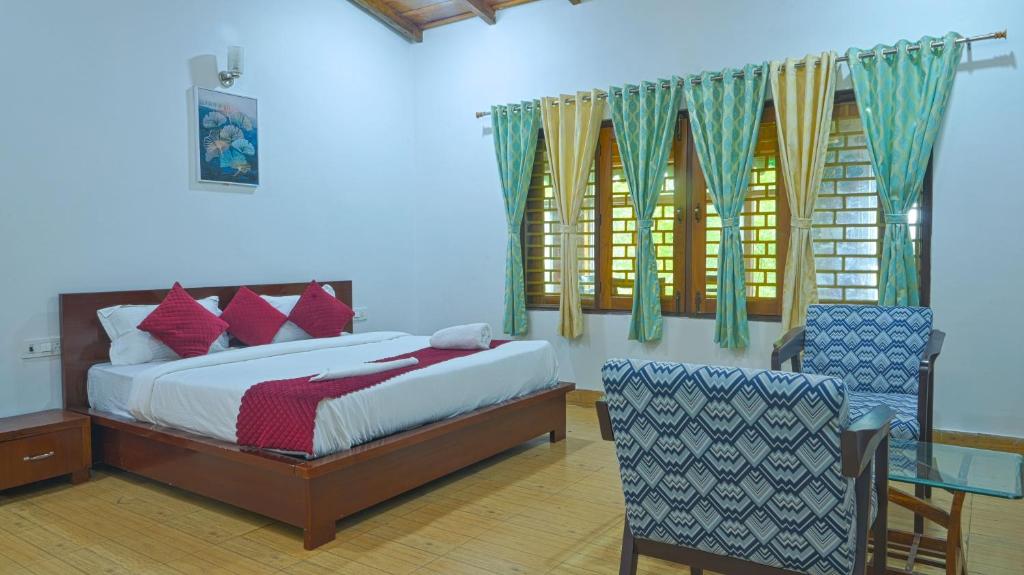 a bedroom with a bed and a table and chairs at Rudraksha Villa Bhimtal in Bhīm Tāl
