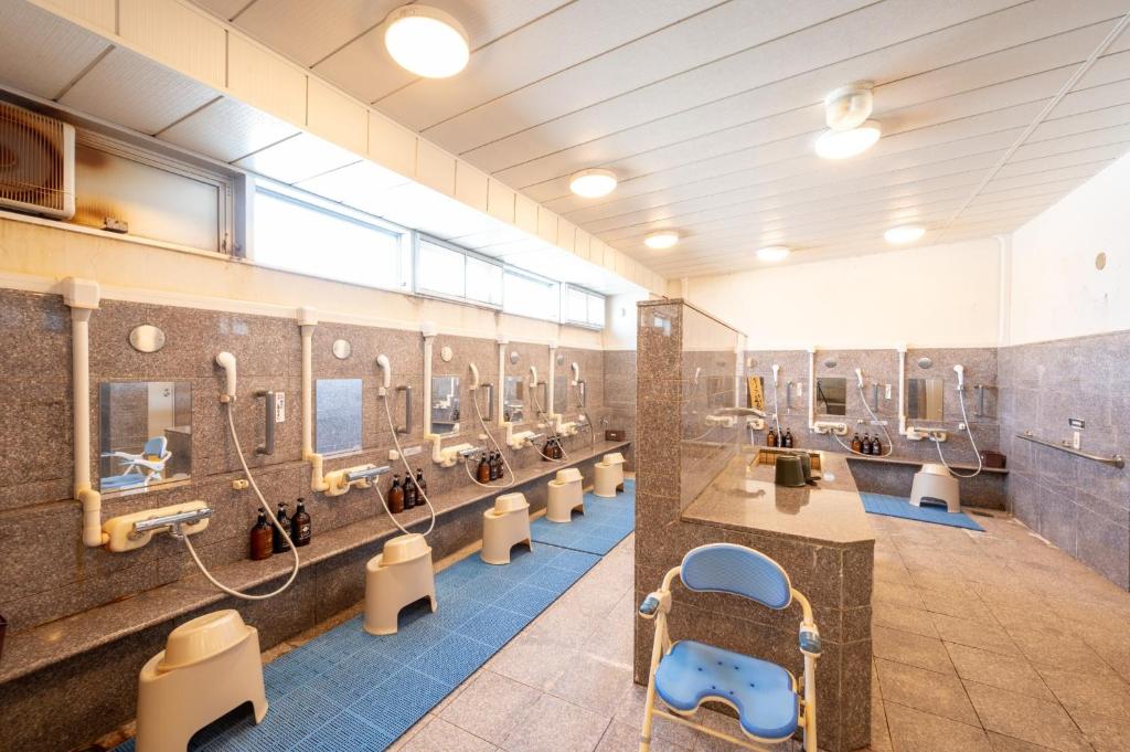 a bathroom with a row of sinks and mirrors at Utage HANARE - Vacation STAY 93680v in Kainan