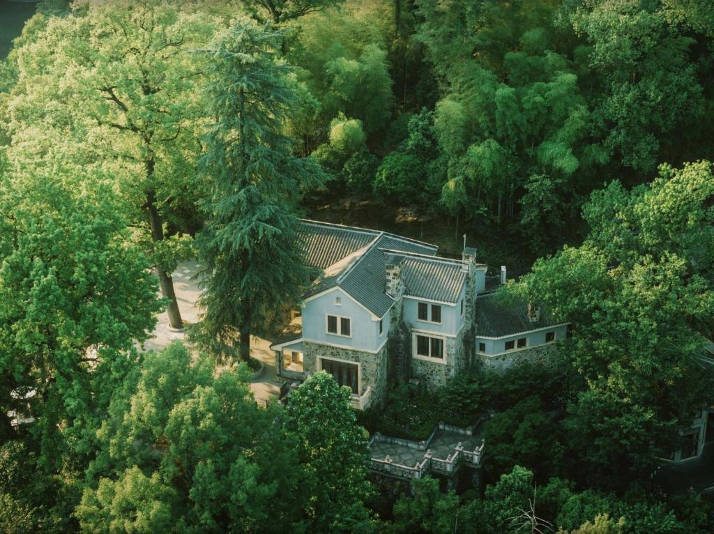an aerial view of a house in the woods at Liuchunwu Resort in Tianmu Mountain in Menkou