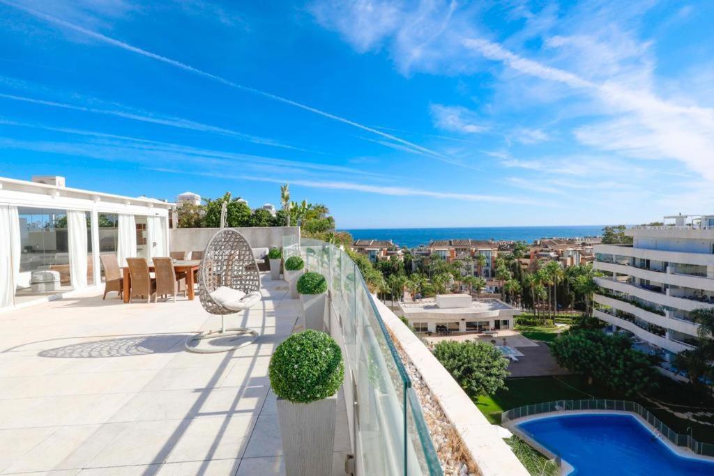 a balcony with a view of the ocean at Luxurious Penthouse in Marbella