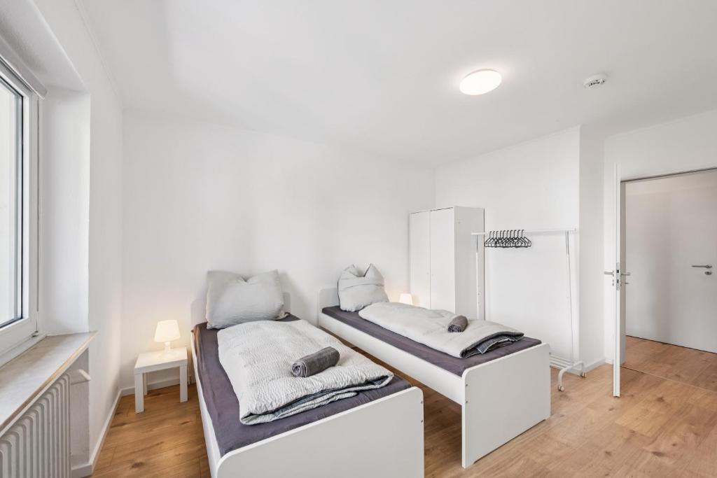 เตียงในห้องที่ Lüdenscheid Stay- Moderne Monteurzimmer