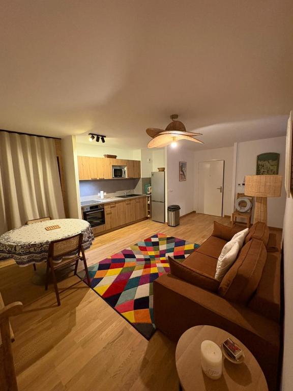 a living room with a couch and a table at Vars Livingstone in Vars