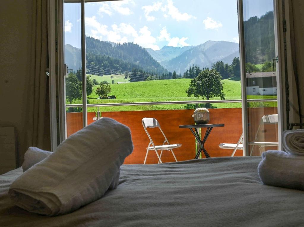 a bedroom with a bed and a view of a mountain at Ferienwohnung Bergblick in Gallzein