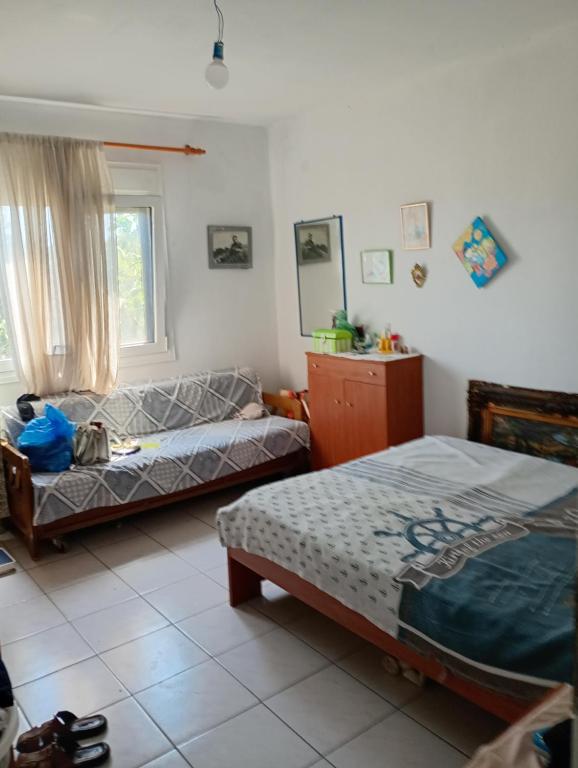Ένα ή περισσότερα κρεβάτια σε δωμάτιο στο Lake House Fanari