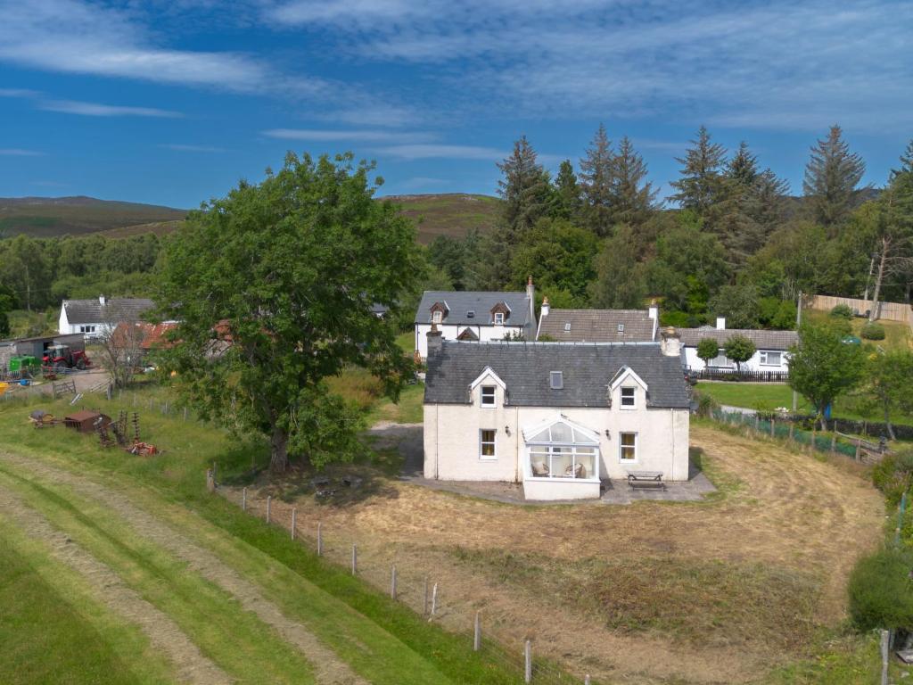 an aerial view of a white house on a hill at Holiday Home The Manor House by Interhome in Balnain