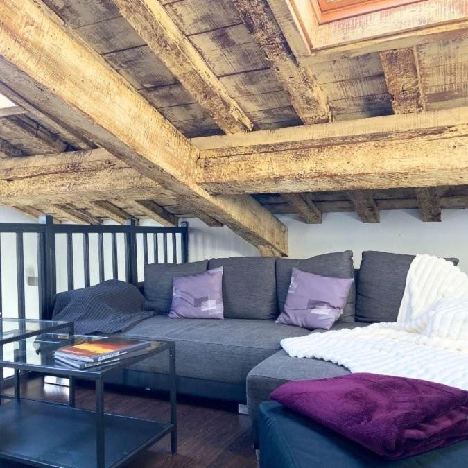 a living room with a couch and a table at La table ronde in Vienne