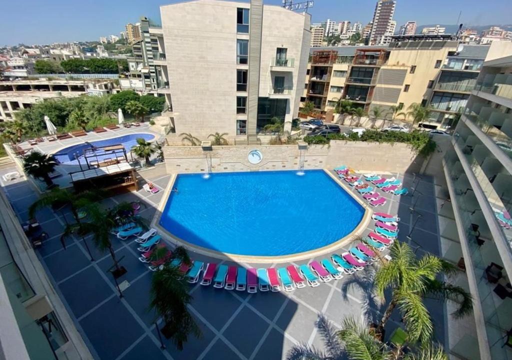 an overhead view of a swimming pool on a building at Sunshine Resort - Tabarja, Lebanon in An Nā‘ūrah