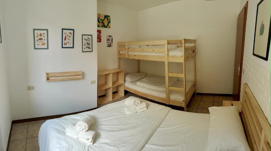 a bedroom with two bunk beds in a room at Il Terrazzino Val di Sole in Monclassico