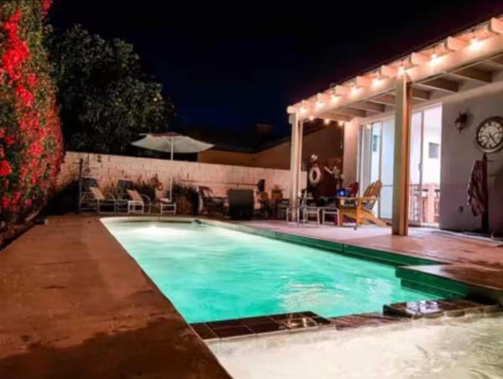 a swimming pool in a backyard at night at Oasis in Indio, La Quinta with Private Pool & Spa in Indio
