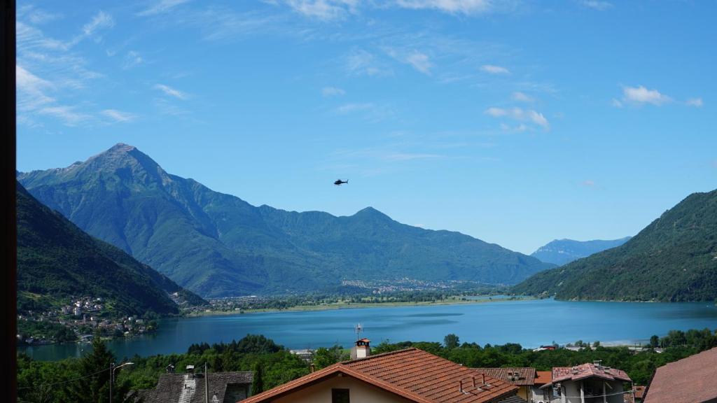 a view of a lake with mountains in the background at The Heritage Home in Novate Mezzola