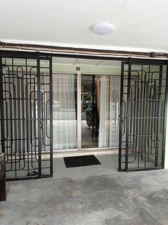 an open door to a room with wrought iron gates at Newly Renovated Danau Kota Terrace House in Kuala Lumpur