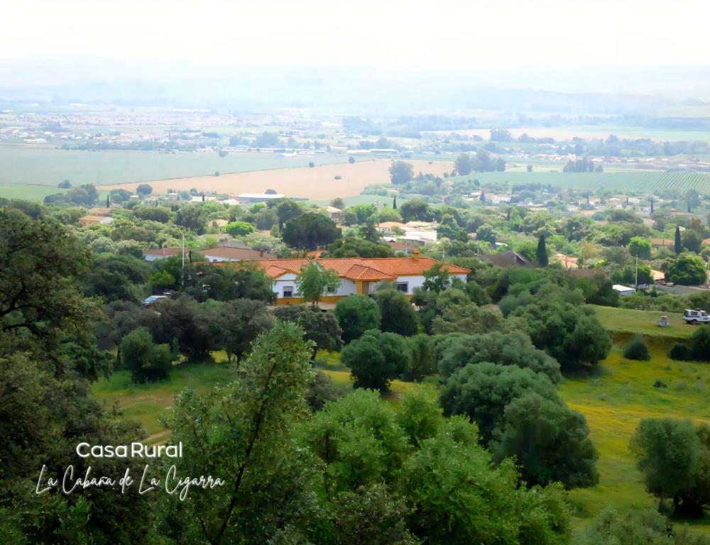 a view of a town from the top of a hill at La Cabaña de la Cigarra in Almodóvar del Río