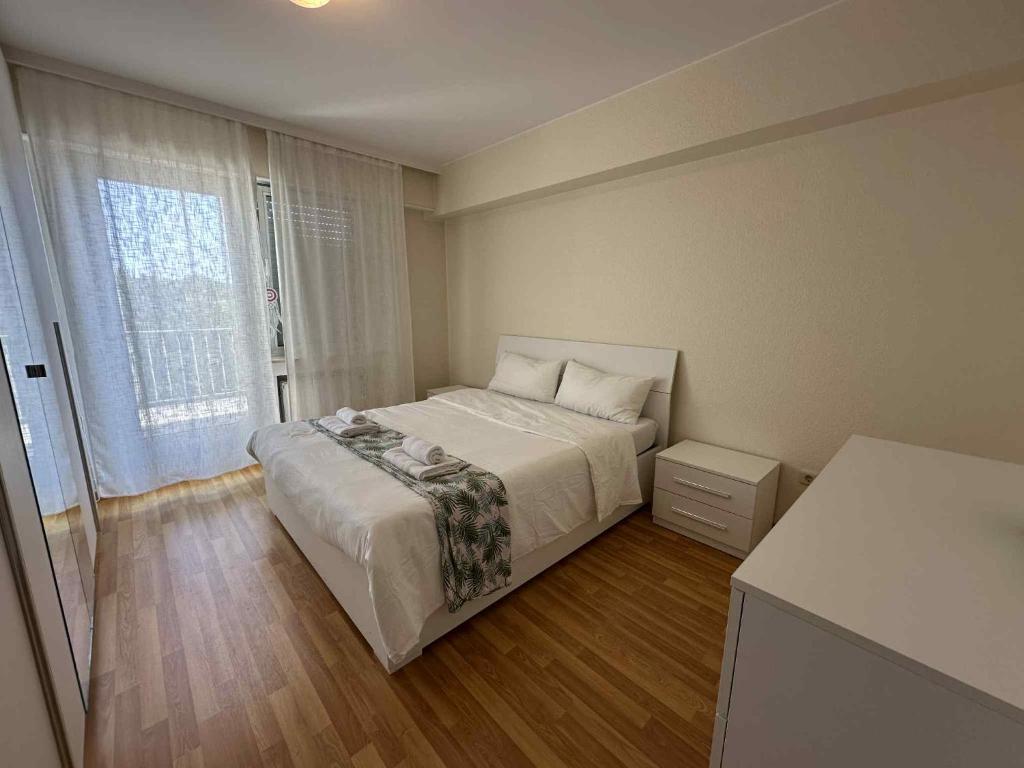 a small bedroom with a bed and a window at Rooftop 1 bed sleeps 4 in Luxembourg