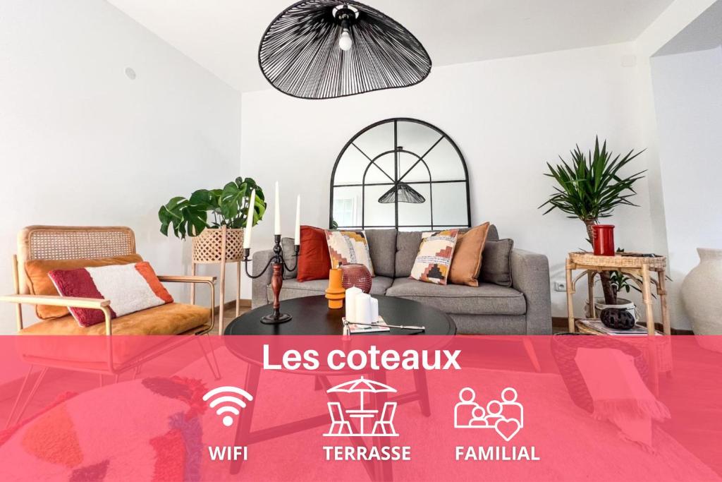 a living room with a couch and a table at expat renting - Les Coteaux - Jardin - Spacieux in Castanet-Tolosan