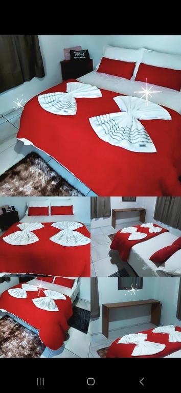 a room with a bed with a red and white comforter at Casa Névoa in Canela