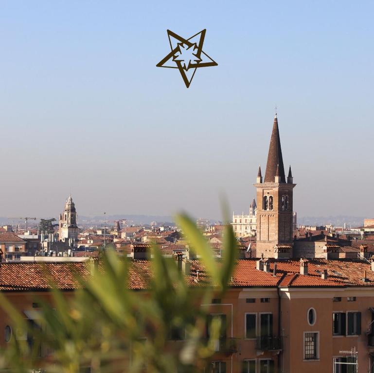 a star kite flying over a city with a church at Stelle di Verona - Selene in Verona