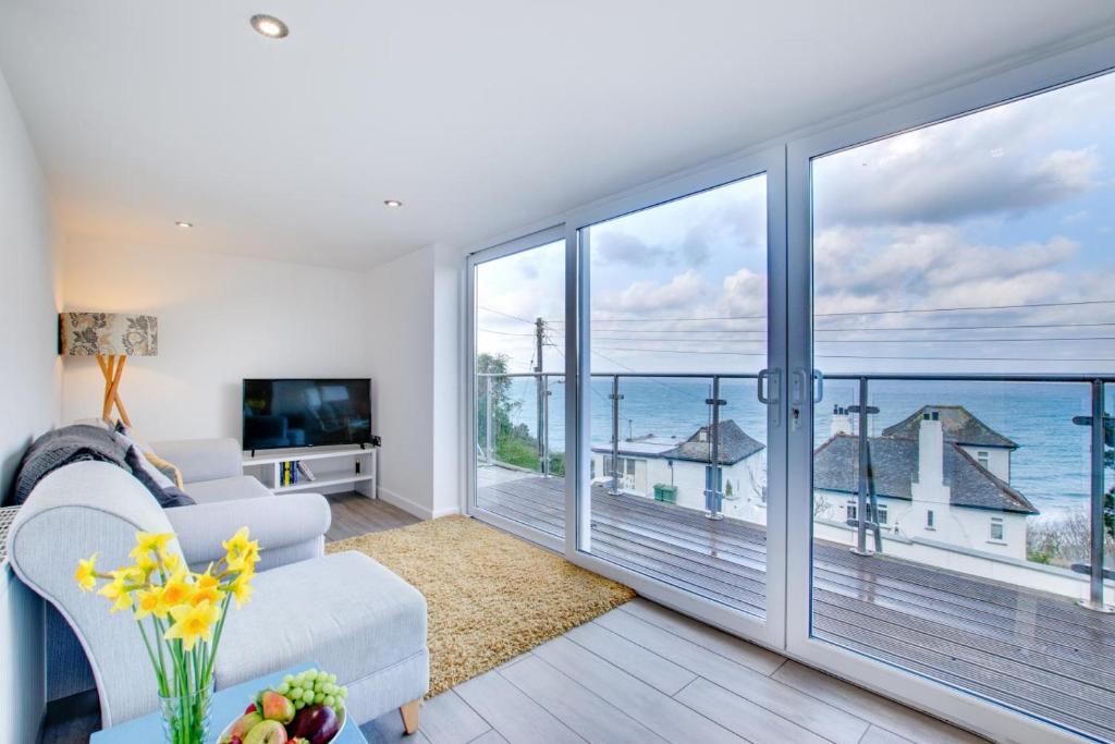 a living room with a view of the ocean at Flat 1 Holmesdale in Carbis Bay