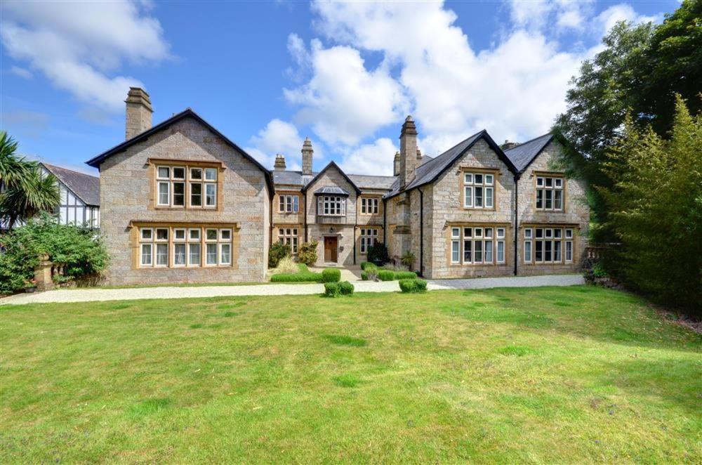 a large brick house with a large yard at 2 Bed in Penzance oc-pc467 in Gulval