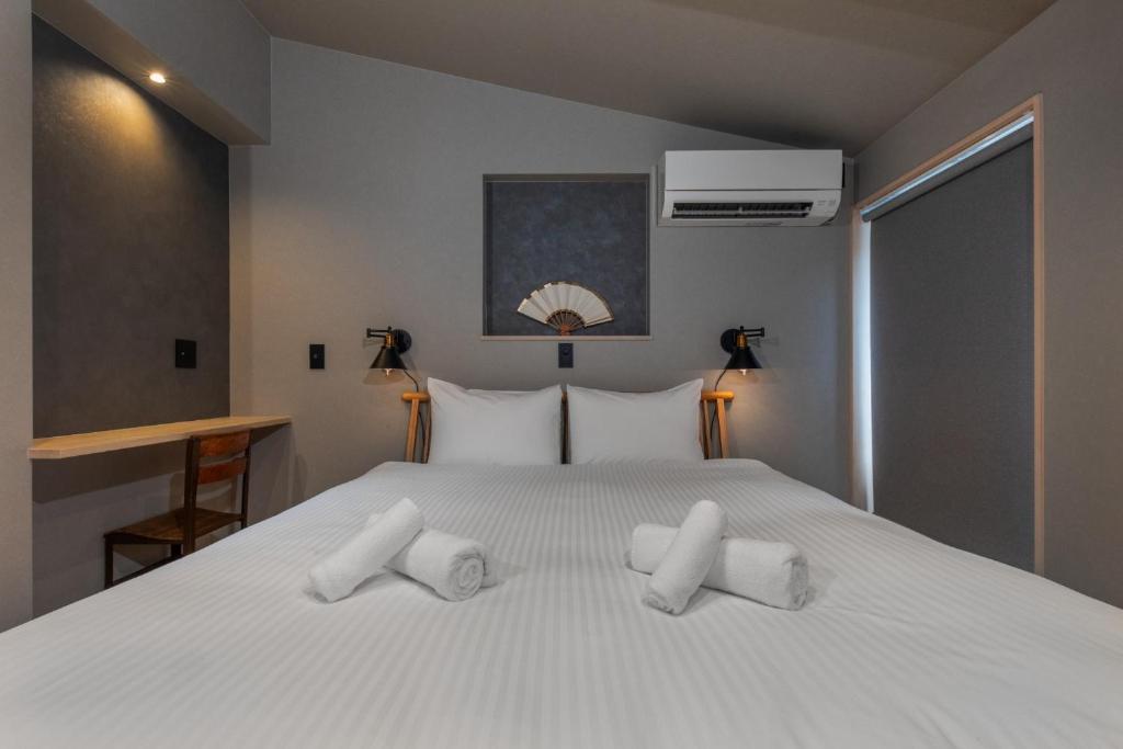 Postel nebo postele na pokoji v ubytování Kyoto Higashiyama-ku - House - Vacation STAY 19825