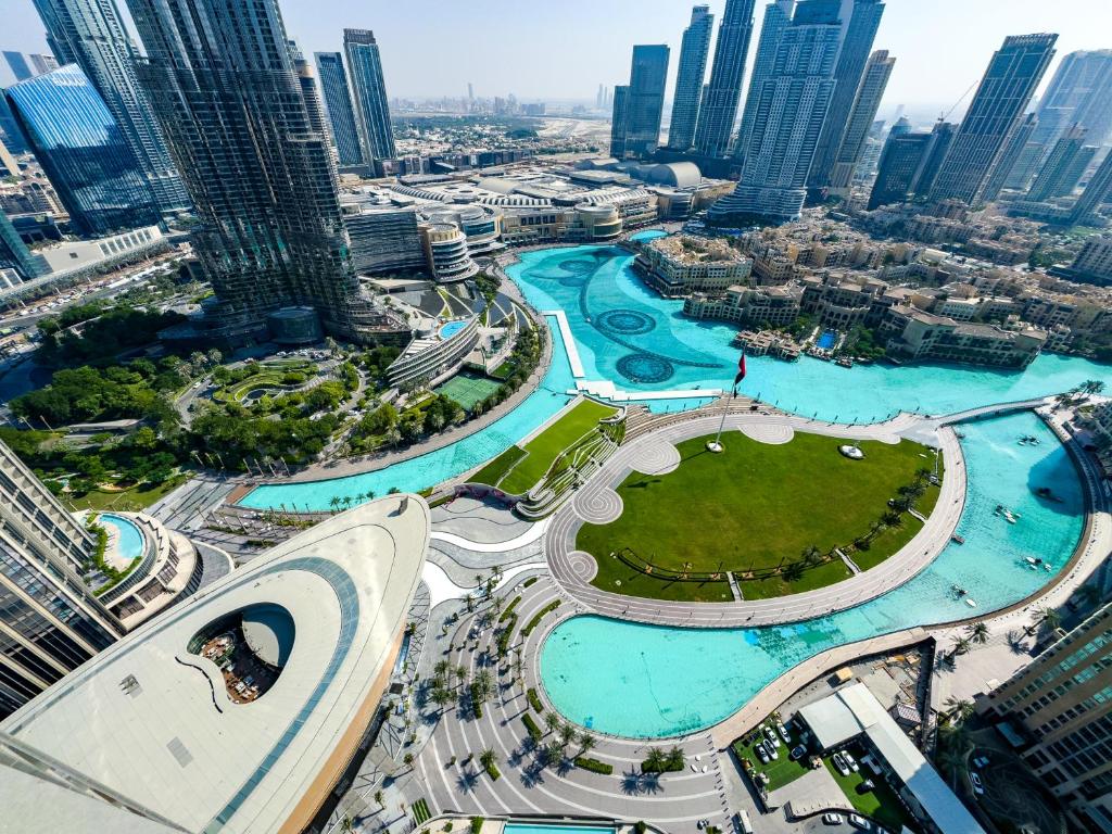 an aerial view of a city with tall buildings at GRANDE RESIDENCES with a direct Burj Khalifa view and Private Fountain Show at 62nd floor with DXB AIRPORT VIP Shuttle for 6 guests in Dubai