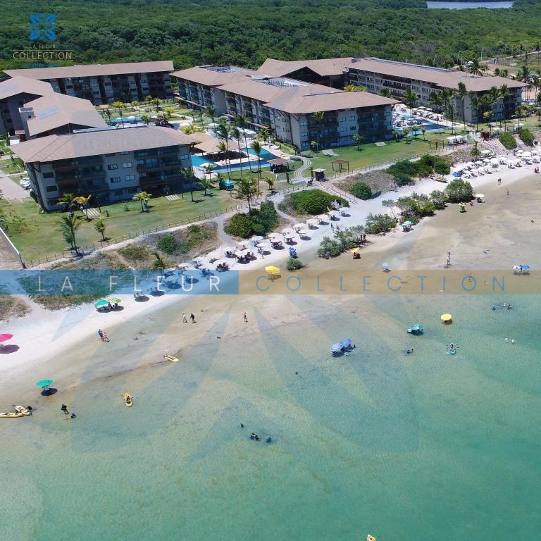 an aerial view of a beach and a resort at La Fleur Collection Vacation Homes - Residence & Resort in Porto De Galinhas